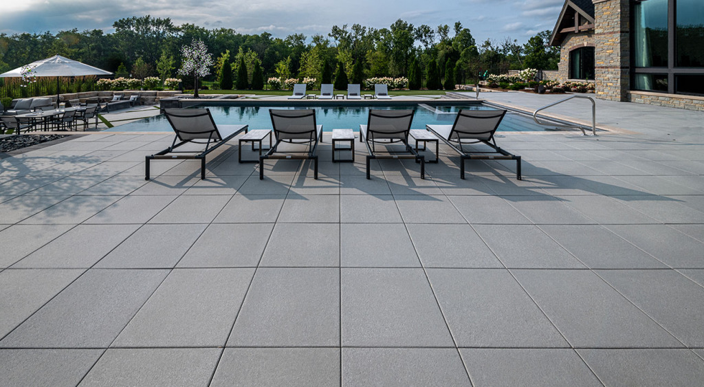 Arcana luxury pool patio with lounge chairs