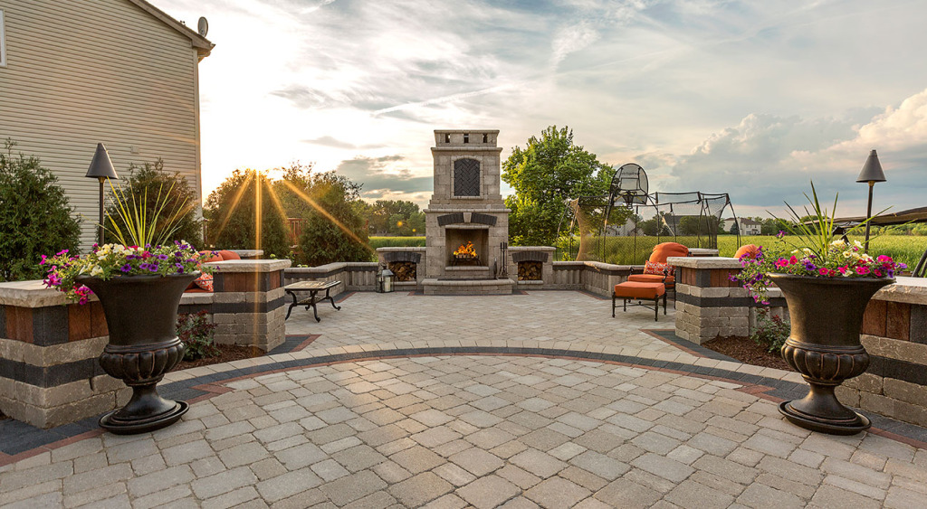 Brussels Block patio with outdoor fireplace at sunset