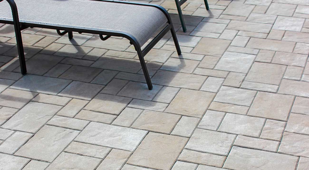 Treo Flagstone poolside patio with loungers